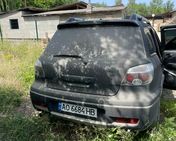 Черный Мицубиси Аутлендер, объемом двигателя 2.35 л и пробегом 260 тыс. км за 5400 $, фото 4 на Automoto.ua