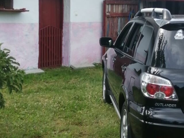 Чорний Міцубісі Аутлендер, об'ємом двигуна 2 л та пробігом 208 тис. км за 6700 $, фото 3 на Automoto.ua