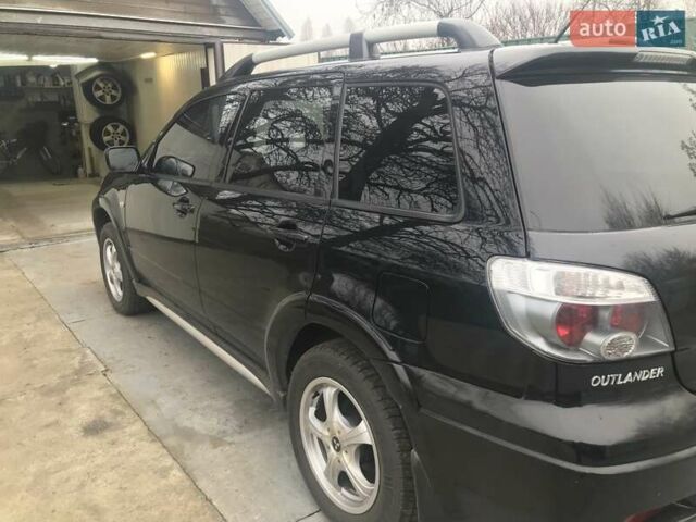 Чорний Міцубісі Аутлендер, об'ємом двигуна 2.38 л та пробігом 207 тис. км за 7000 $, фото 3 на Automoto.ua