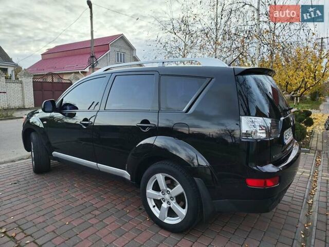 Черный Мицубиси Аутлендер, объемом двигателя 2.36 л и пробегом 192 тыс. км за 8800 $, фото 13 на Automoto.ua