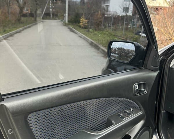 Чорний Міцубісі Аутлендер, об'ємом двигуна 2 л та пробігом 118 тис. км за 8100 $, фото 28 на Automoto.ua