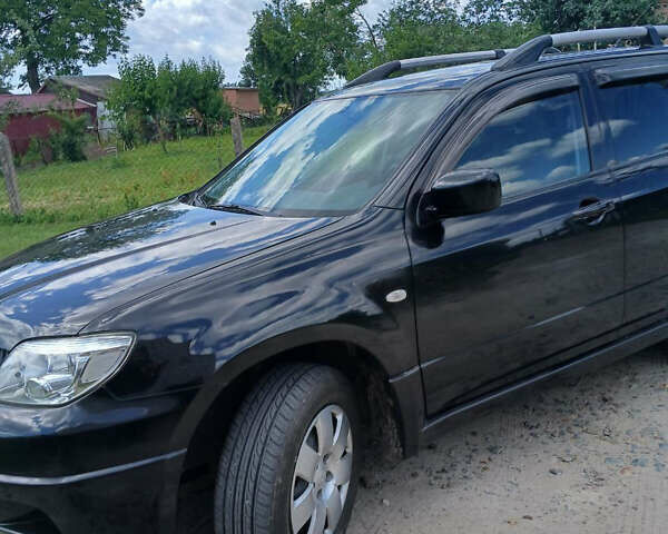 Чорний Міцубісі Аутлендер, об'ємом двигуна 2 л та пробігом 161 тис. км за 7499 $, фото 8 на Automoto.ua