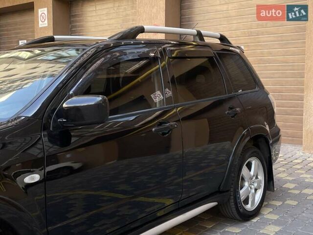 Черный Мицубиси Аутлендер, объемом двигателя 2 л и пробегом 270 тыс. км за 7199 $, фото 7 на Automoto.ua