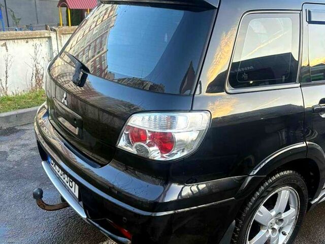 Черный Мицубиси Аутлендер, объемом двигателя 2.4 л и пробегом 231 тыс. км за 8500 $, фото 4 на Automoto.ua