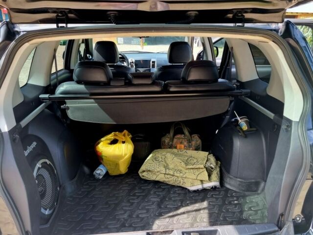 Черный Мицубиси Аутлендер, объемом двигателя 2.4 л и пробегом 234 тыс. км за 9800 $, фото 5 на Automoto.ua