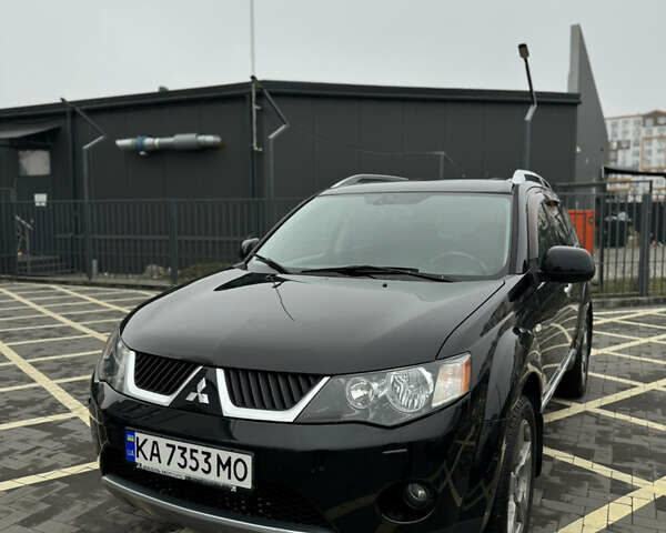 Черный Мицубиси Аутлендер, объемом двигателя 2.36 л и пробегом 120 тыс. км за 10100 $, фото 2 на Automoto.ua