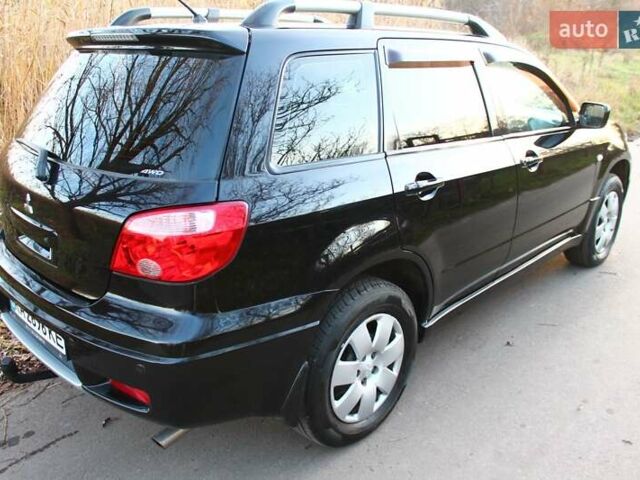 Черный Мицубиси Аутлендер, объемом двигателя 2 л и пробегом 190 тыс. км за 6900 $, фото 20 на Automoto.ua