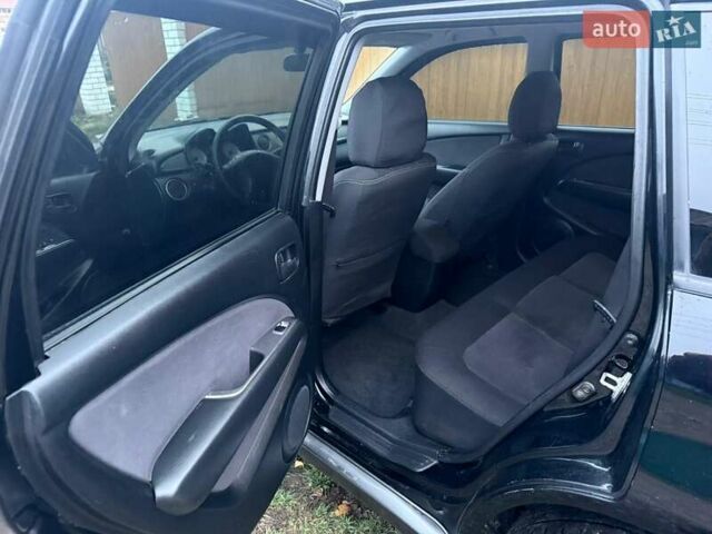 Черный Мицубиси Аутлендер, объемом двигателя 2 л и пробегом 232 тыс. км за 7000 $, фото 10 на Automoto.ua