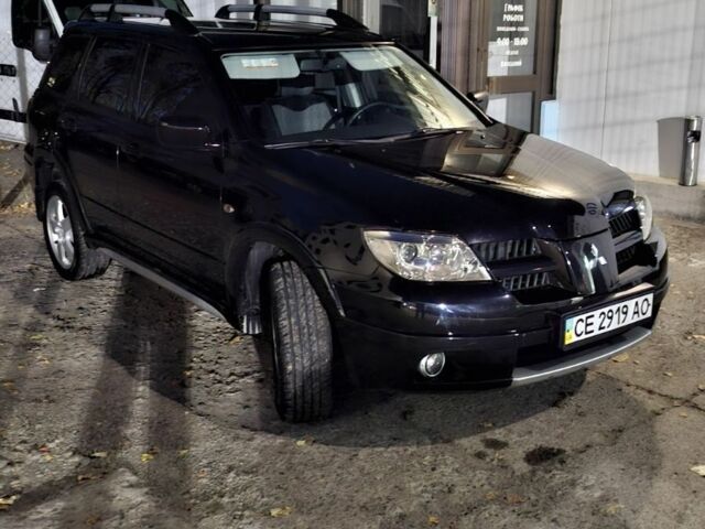 Чорний Міцубісі Аутлендер, об'ємом двигуна 2 л та пробігом 117 тис. км за 7900 $, фото 3 на Automoto.ua