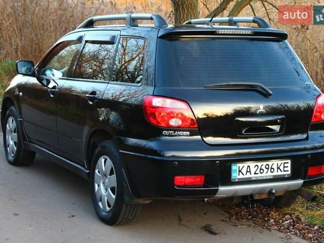 Черный Мицубиси Аутлендер, объемом двигателя 2 л и пробегом 189 тыс. км за 7200 $, фото 24 на Automoto.ua