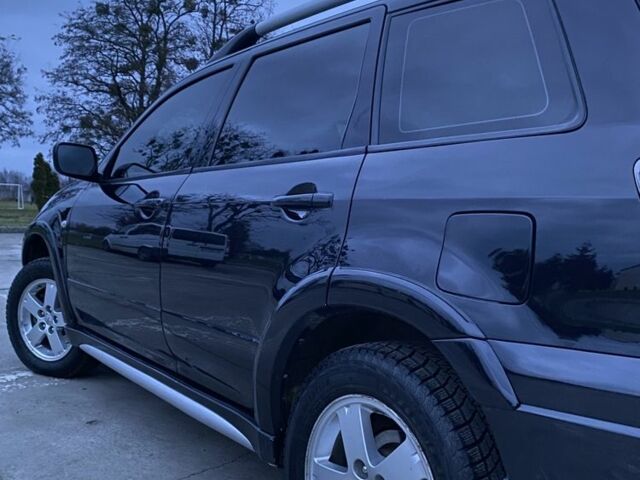 Чорний Міцубісі Аутлендер, об'ємом двигуна 2 л та пробігом 271 тис. км за 6799 $, фото 2 на Automoto.ua