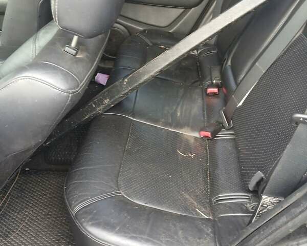 Черный Мицубиси Аутлендер, объемом двигателя 2.38 л и пробегом 270 тыс. км за 1700 $, фото 1 на Automoto.ua