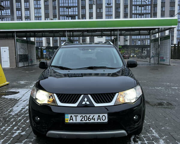 Черный Мицубиси Аутлендер, объемом двигателя 2.36 л и пробегом 204 тыс. км за 9990 $, фото 2 на Automoto.ua
