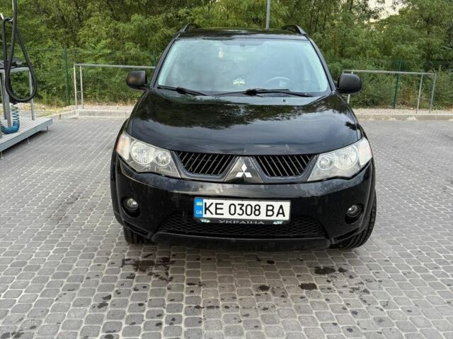 Черный Мицубиси Аутлендер, объемом двигателя 2.4 л и пробегом 369 тыс. км за 8500 $, фото 2 на Automoto.ua