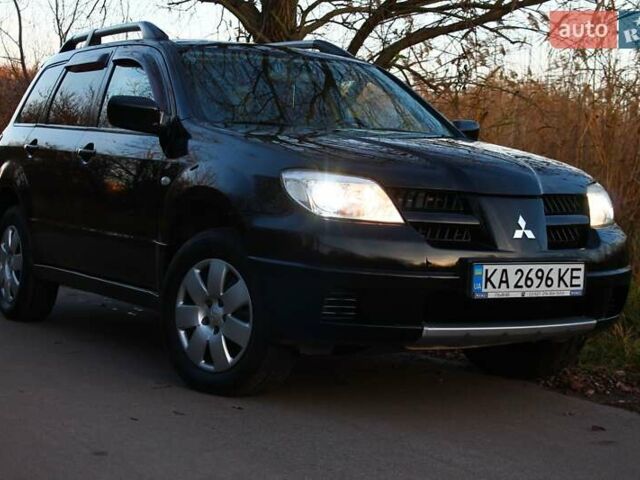 Черный Мицубиси Аутлендер, объемом двигателя 2 л и пробегом 189 тыс. км за 7200 $, фото 4 на Automoto.ua