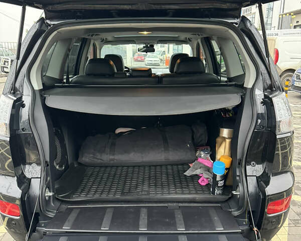 Черный Мицубиси Аутлендер, объемом двигателя 2.36 л и пробегом 120 тыс. км за 10100 $, фото 13 на Automoto.ua