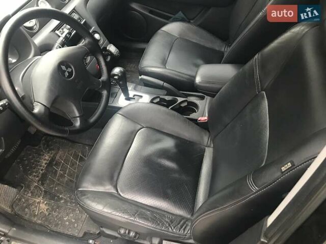 Чорний Міцубісі Аутлендер, об'ємом двигуна 2.38 л та пробігом 207 тис. км за 7000 $, фото 21 на Automoto.ua