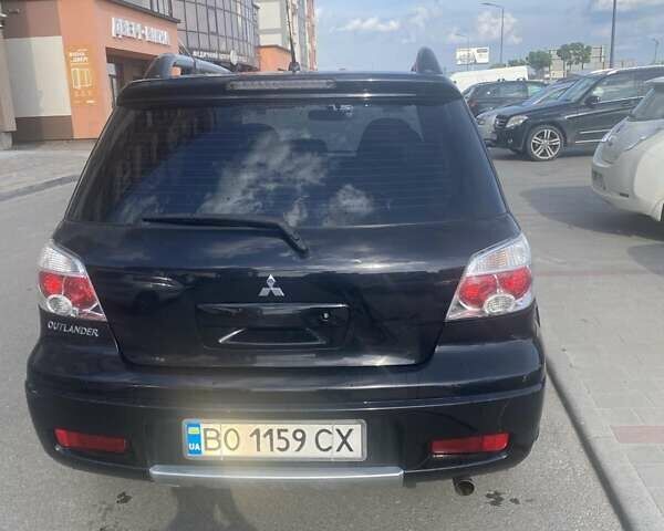 Чорний Міцубісі Аутлендер, об'ємом двигуна 2 л та пробігом 178 тис. км за 6850 $, фото 12 на Automoto.ua