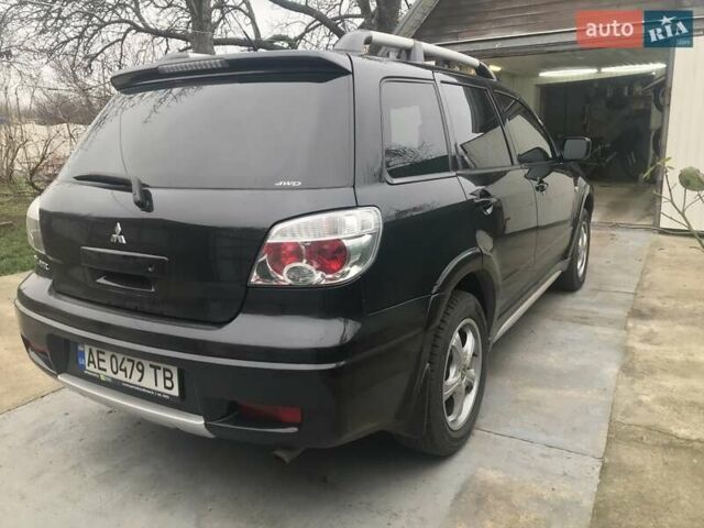 Чорний Міцубісі Аутлендер, об'ємом двигуна 2.38 л та пробігом 207 тис. км за 7000 $, фото 7 на Automoto.ua
