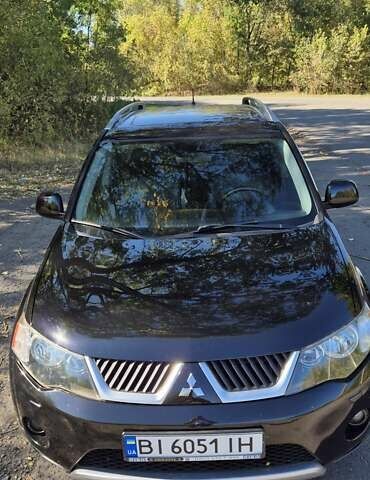 Черный Мицубиси Аутлендер, объемом двигателя 2.4 л и пробегом 178 тыс. км за 9150 $, фото 1 на Automoto.ua