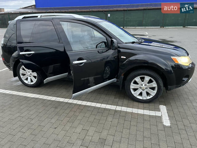 Черный Мицубиси Аутлендер, объемом двигателя 1.97 л и пробегом 244 тыс. км за 8700 $, фото 5 на Automoto.ua