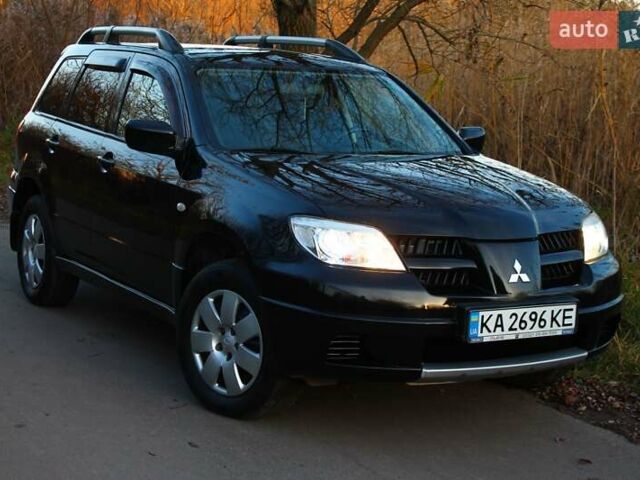 Черный Мицубиси Аутлендер, объемом двигателя 2 л и пробегом 189 тыс. км за 7200 $, фото 39 на Automoto.ua