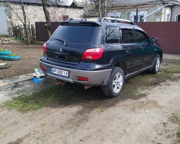 Черный Мицубиси Аутлендер, объемом двигателя 2 л и пробегом 263 тыс. км за 6900 $, фото 7 на Automoto.ua