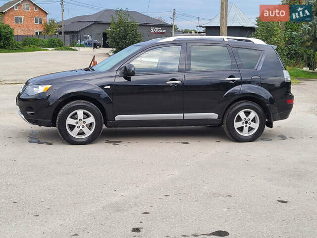 Чорний Міцубісі Аутлендер, об'ємом двигуна 2.4 л та пробігом 205 тис. км за 8400 $, фото 7 на Automoto.ua