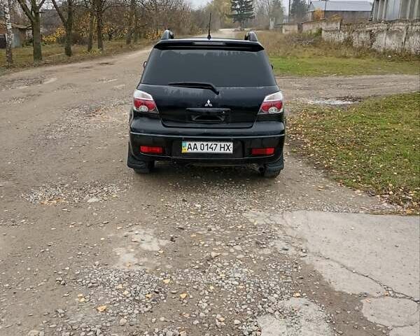 Черный Мицубиси Аутлендер, объемом двигателя 2 л и пробегом 209 тыс. км за 5700 $, фото 11 на Automoto.ua