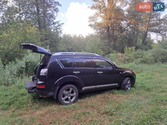 Черный Мицубиси Аутлендер, объемом двигателя 2.36 л и пробегом 245 тыс. км за 9200 $, фото 8 на Automoto.ua