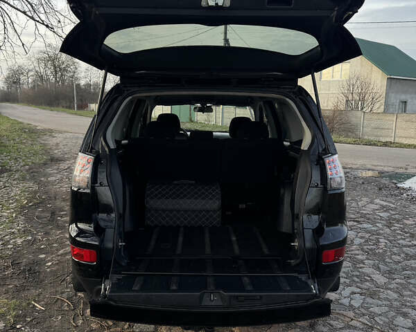 Чорний Міцубісі Аутлендер, об'ємом двигуна 2.36 л та пробігом 293 тис. км за 7900 $, фото 24 на Automoto.ua