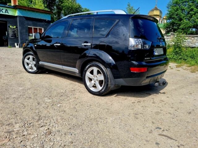 Черный Мицубиси Аутлендер, объемом двигателя 2.4 л и пробегом 234 тыс. км за 9800 $, фото 2 на Automoto.ua