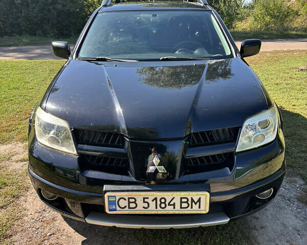 Міцубісі Аутлендер 2008 у Києві на Automoto.ua Чорний Міцубісі Аутлендер, об'ємом двигуна 2 л та пробігом 228 тис. км за 7300 $, фото 6 на Automoto.ua