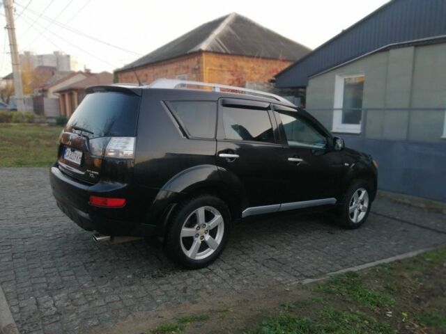Черный Мицубиси Аутлендер, объемом двигателя 2.4 л и пробегом 228 тыс. км за 7850 $, фото 3 на Automoto.ua