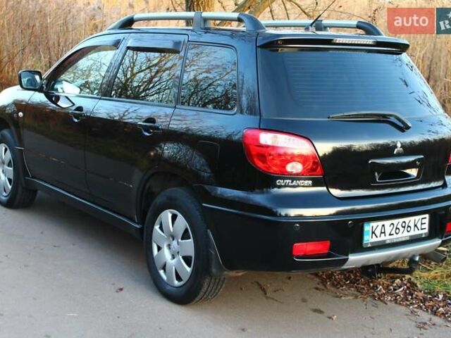 Черный Мицубиси Аутлендер, объемом двигателя 2 л и пробегом 189 тыс. км за 7200 $, фото 16 на Automoto.ua