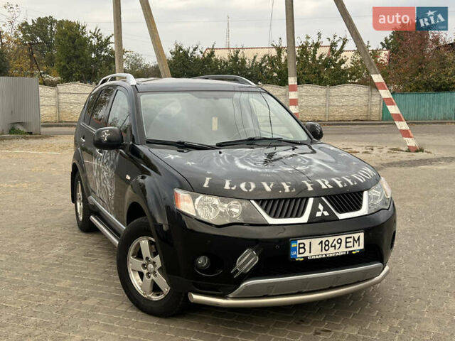 Черный Мицубиси Аутлендер, объемом двигателя 2.4 л и пробегом 230 тыс. км за 6650 $, фото 3 на Automoto.ua