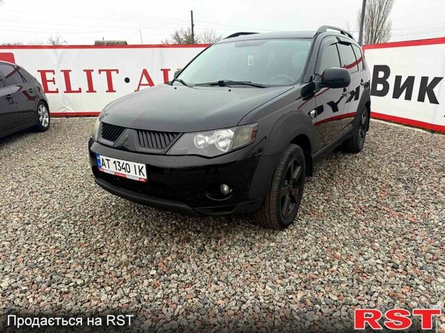 Черный Мицубиси Аутлендер, объемом двигателя 2.4 л и пробегом 200 тыс. км за 9999 $, фото 2 на Automoto.ua