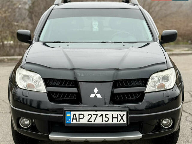 Черный Мицубиси Аутлендер, объемом двигателя 2.4 л и пробегом 245 тыс. км за 6500 $, фото 3 на Automoto.ua