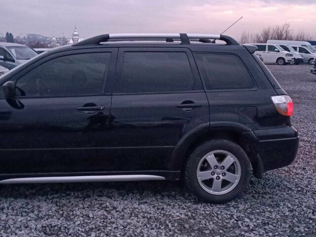 Черный Мицубиси Аутлендер, объемом двигателя 2 л и пробегом 271 тыс. км за 6940 $, фото 4 на Automoto.ua