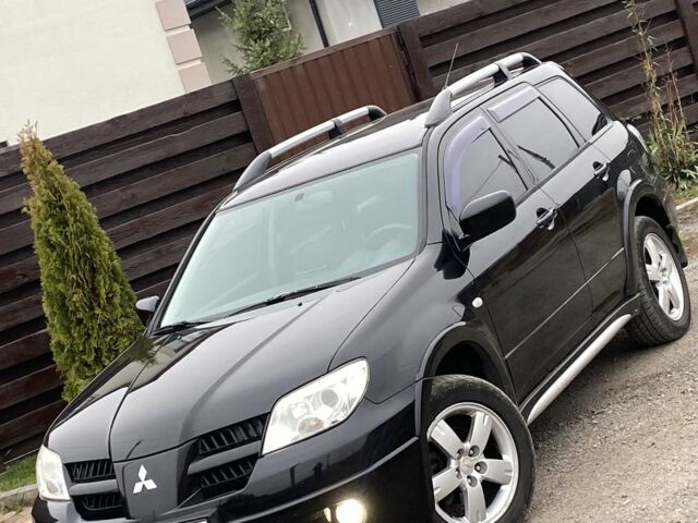 Черный Мицубиси Аутлендер, объемом двигателя 2.4 л и пробегом 178 тыс. км за 6900 $, фото 11 на Automoto.ua