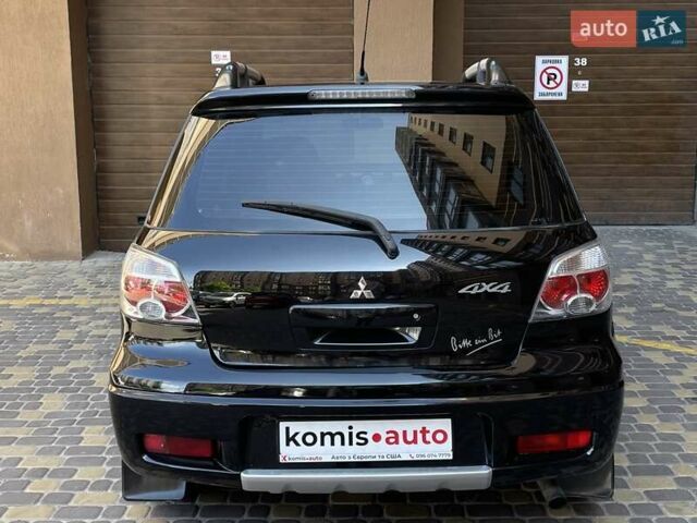 Черный Мицубиси Аутлендер, объемом двигателя 2 л и пробегом 270 тыс. км за 7199 $, фото 18 на Automoto.ua