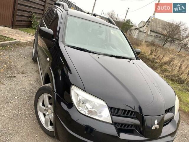 Черный Мицубиси Аутлендер, объемом двигателя 2.4 л и пробегом 178 тыс. км за 6900 $, фото 9 на Automoto.ua