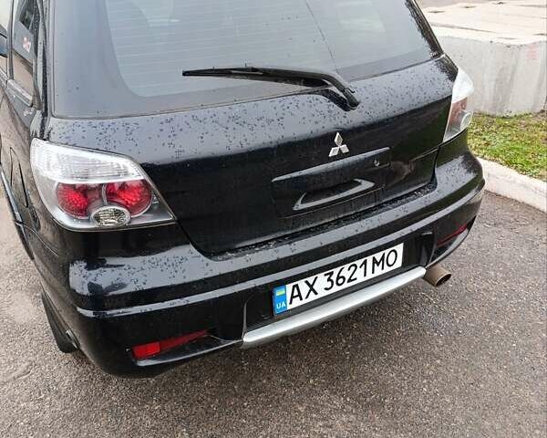 Мицубиси Аутлендер 2008 в Изюме на Automoto.ua Черный Мицубиси Аутлендер, объемом двигателя 2 л и пробегом 270 тыс. км за 7200 $, фото 6 на Automoto.ua