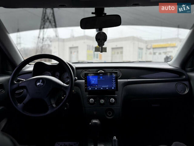 Черный Мицубиси Аутлендер, объемом двигателя 2.4 л и пробегом 245 тыс. км за 6500 $, фото 9 на Automoto.ua