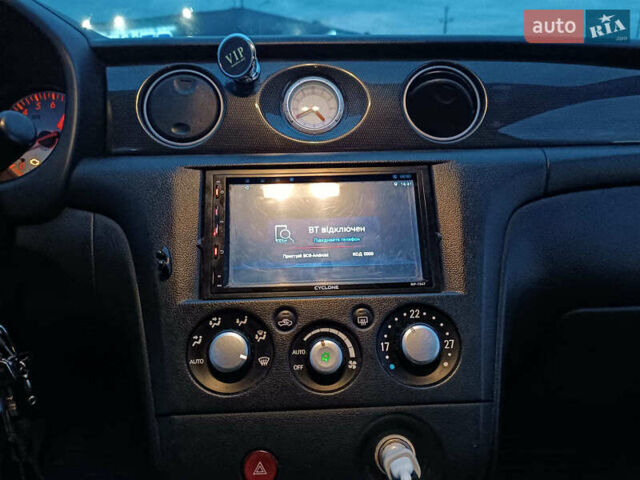Чорний Міцубісі Аутлендер, об'ємом двигуна 2 л та пробігом 271 тис. км за 6940 $, фото 26 на Automoto.ua