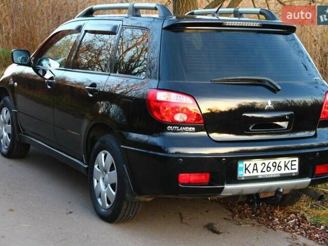 Черный Мицубиси Аутлендер, объемом двигателя 2 л и пробегом 189 тыс. км за 7200 $, фото 25 на Automoto.ua