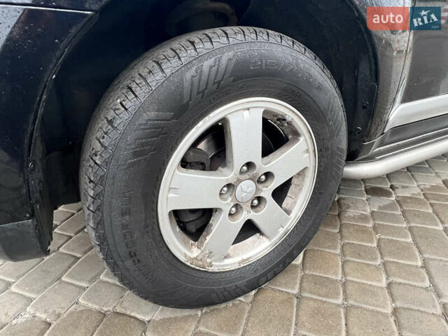 Черный Мицубиси Аутлендер, объемом двигателя 2.4 л и пробегом 230 тыс. км за 6650 $, фото 59 на Automoto.ua