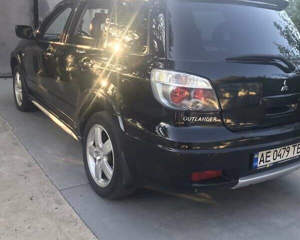 Чорний Міцубісі Аутлендер, об'ємом двигуна 2.38 л та пробігом 207 тис. км за 7000 $, фото 59 на Automoto.ua