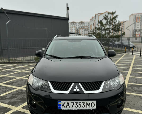Черный Мицубиси Аутлендер, объемом двигателя 2.36 л и пробегом 120 тыс. км за 10100 $, фото 1 на Automoto.ua