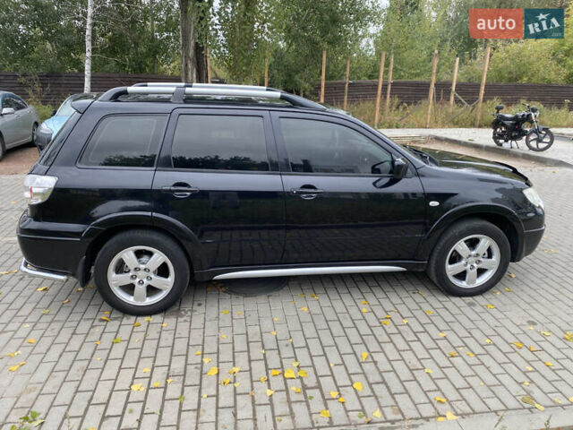 Чорний Міцубісі Аутлендер, об'ємом двигуна 2.38 л та пробігом 252 тис. км за 7200 $, фото 7 на Automoto.ua